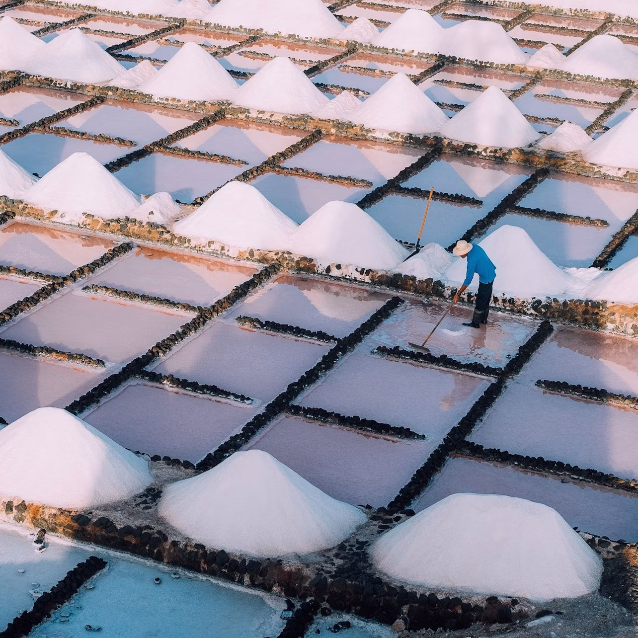 View from the water mill of the salt maker at work in Salinas de Janubio.