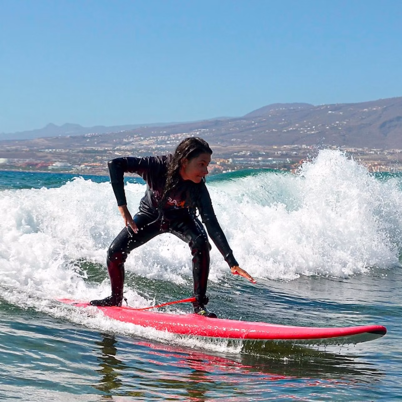 client surfing her wave