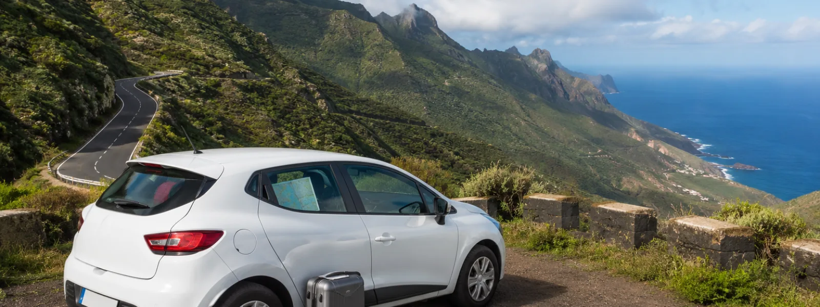 Compact rental car on a scenic north Tenerife mountain road for a Tenerife North Airport car hire guide