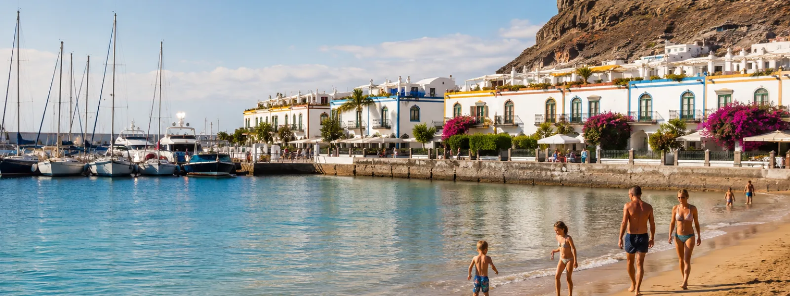 Family beach holiday in Puerto de Mogan, Gran Canaria with marina and calm water