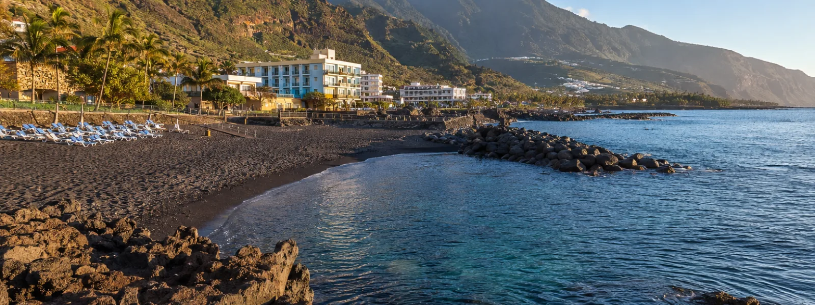 Los Cancajos black sand beach and volcanic breakwaters in La Palma
