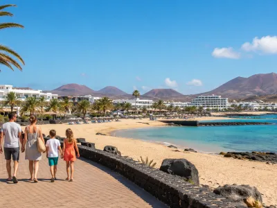 Family walking by a sheltered Canary Islands beach, representing Caleta de Fuste and Costa Teguise family holidays