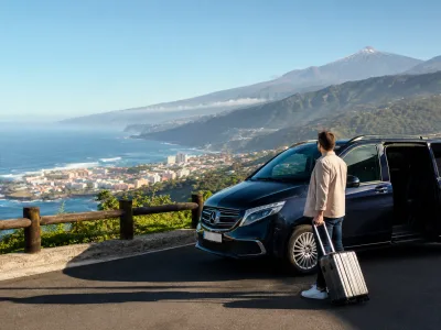 Airport transfer vehicle above Puerto de la Cruz on Tenerife's green north coast