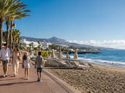 Sunny Canary Islands resort promenade for a Tenerife vs Gran Canaria winter sun holiday