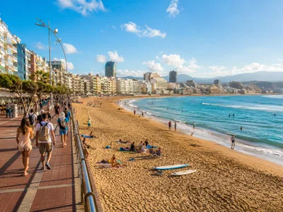 Las Canteras beach and promenade in Las Palmas de Gran Canaria with city hotels behind the sand