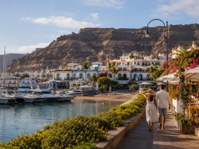 Puerto de Mogan marina and sheltered beach in Gran Canaria for couples comparing Puerto Rico and Puerto de Mogan