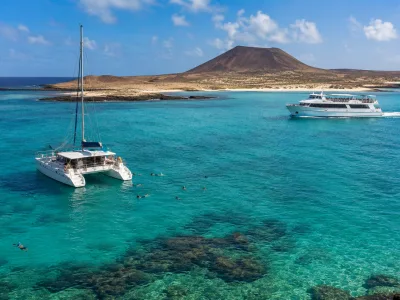 Boat trip from Corralejo to Lobos Island in Fuerteventura with clear turquoise water