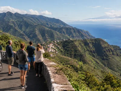 Travellers looking over La Gomera's green ravines on a day trip from Tenerife