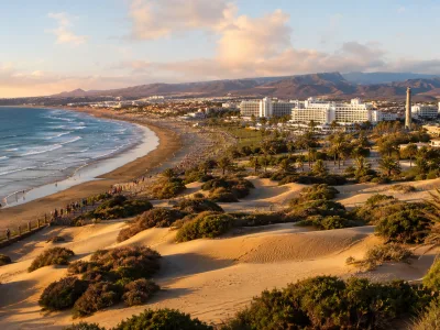 Golden-hour view of Playa del Ingles, Maspalomas Dunes and resort hotels in Gran Canaria