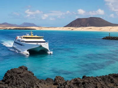 Ferry crossing between Lanzarote and Fuerteventura with Corralejo dunes and Atlantic sea views