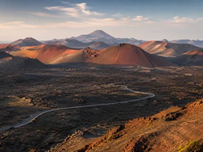 Volcanic landscape of Timanfaya National Park in Lanzarote with red craters and black lava fields