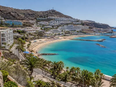 Puerto Rico and Amadores coastline in Gran Canaria with hillside hotels and beach areas
