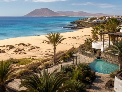 Fuerteventura resort coastline with dunes and turquoise Atlantic water