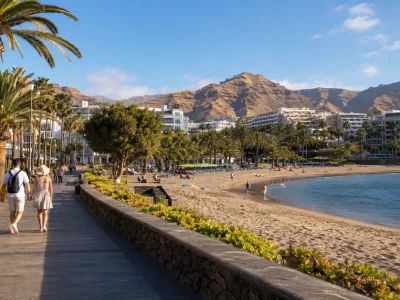 Sunny winter resort promenade and beach in the Canary Islands