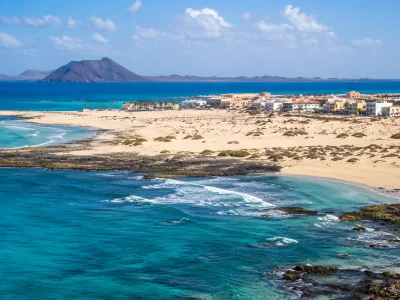 Corralejo dunes, turquoise sea and resort coastline in northern Fuerteventura