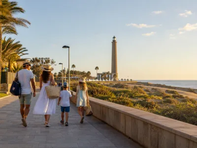 Family walking near the Maspalomas lighthouse and Meloneras promenade in Gran Canaria