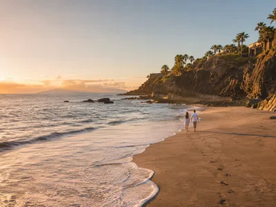 Quiet Tenerife beach cove at golden hour for couples planning a peaceful coastal stay
