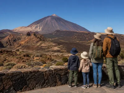 Family looking at Mount Teide from a safe viewpoint in Teide National Park Tenerife