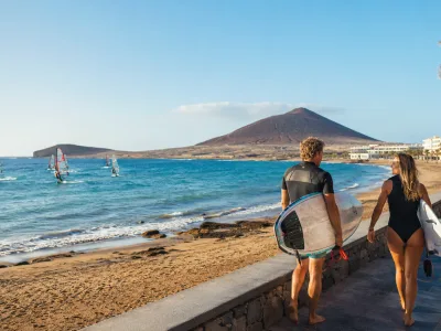 Windsurfers and surfers on the south Tenerife coast near El Medano