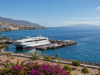 Ferry at Los Cristianos harbour with La Gomera across the Atlantic