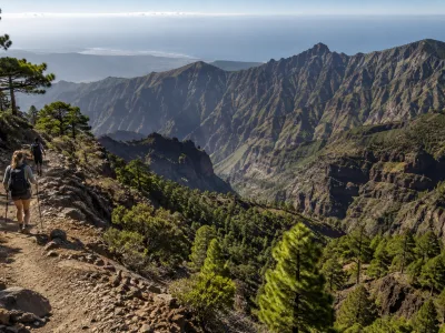 Hiking trail viewpoint in La Palma with volcanic ridges and pine forest