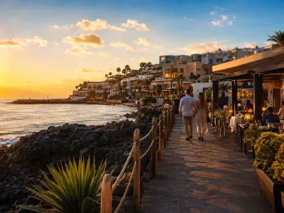 Sunset over La Caleta in Costa Adeje with oceanfront hotels and seafood restaurants