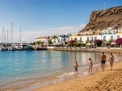 Family beach holiday in Puerto de Mogan, Gran Canaria with marina and calm water