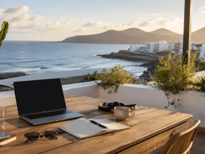 Remote work setup on a sunny Canary Islands terrace overlooking the Atlantic