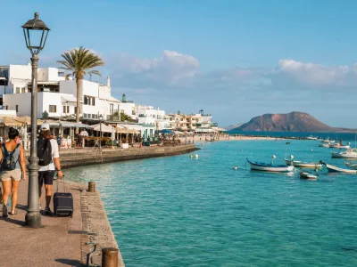 Corralejo harbour and town beach in Fuerteventura with Lobos Island on the horizon