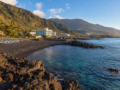Los Cancajos black sand beach and volcanic breakwaters in La Palma
