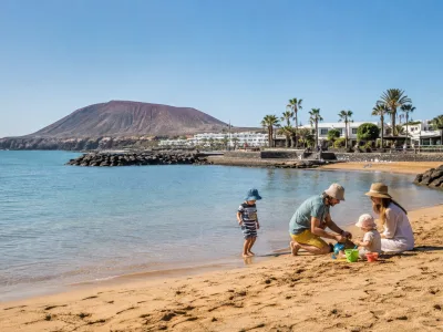 Family with young children on sheltered Playa Flamingo beach in Playa Blanca, Lanzarote