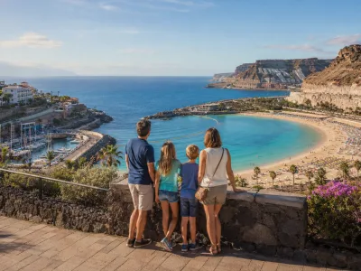 Family overlooking a sheltered Canary Islands beach and marina