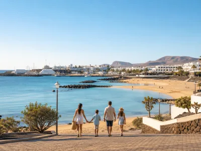 Family walking toward Playa Dorada beach in Playa Blanca, Lanzarote