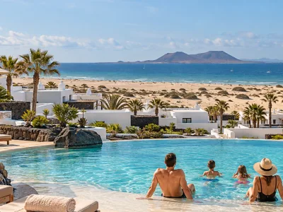 Family resort pool overlooking the Corralejo dunes and Atlantic in Fuerteventura