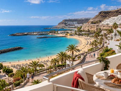 Sunny Puerto Rico and Amadores coastline in Gran Canaria with a holiday apartment terrace at Christmas