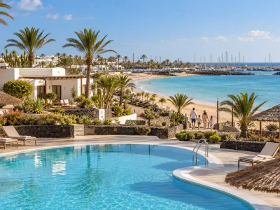 Pool, bungalows and sheltered bay in Caleta de Fuste, Fuerteventura