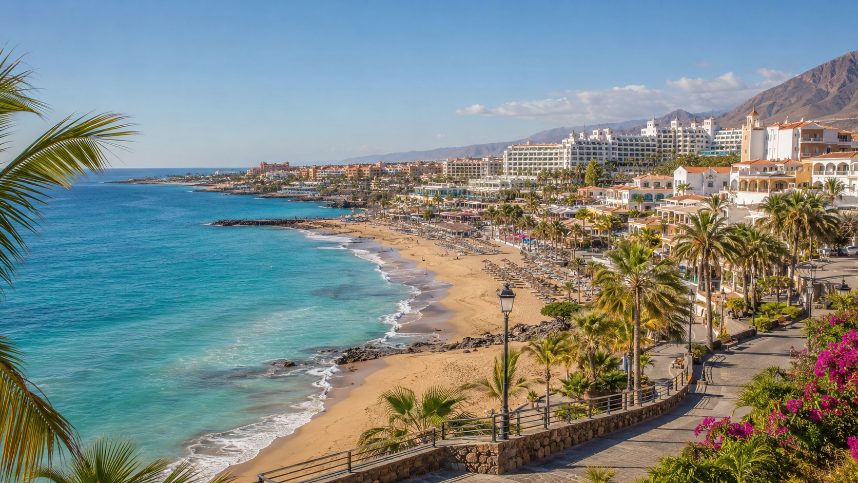 Costa Adeje beach hotel areas with golden sand, palm promenade and resort hotels in Tenerife