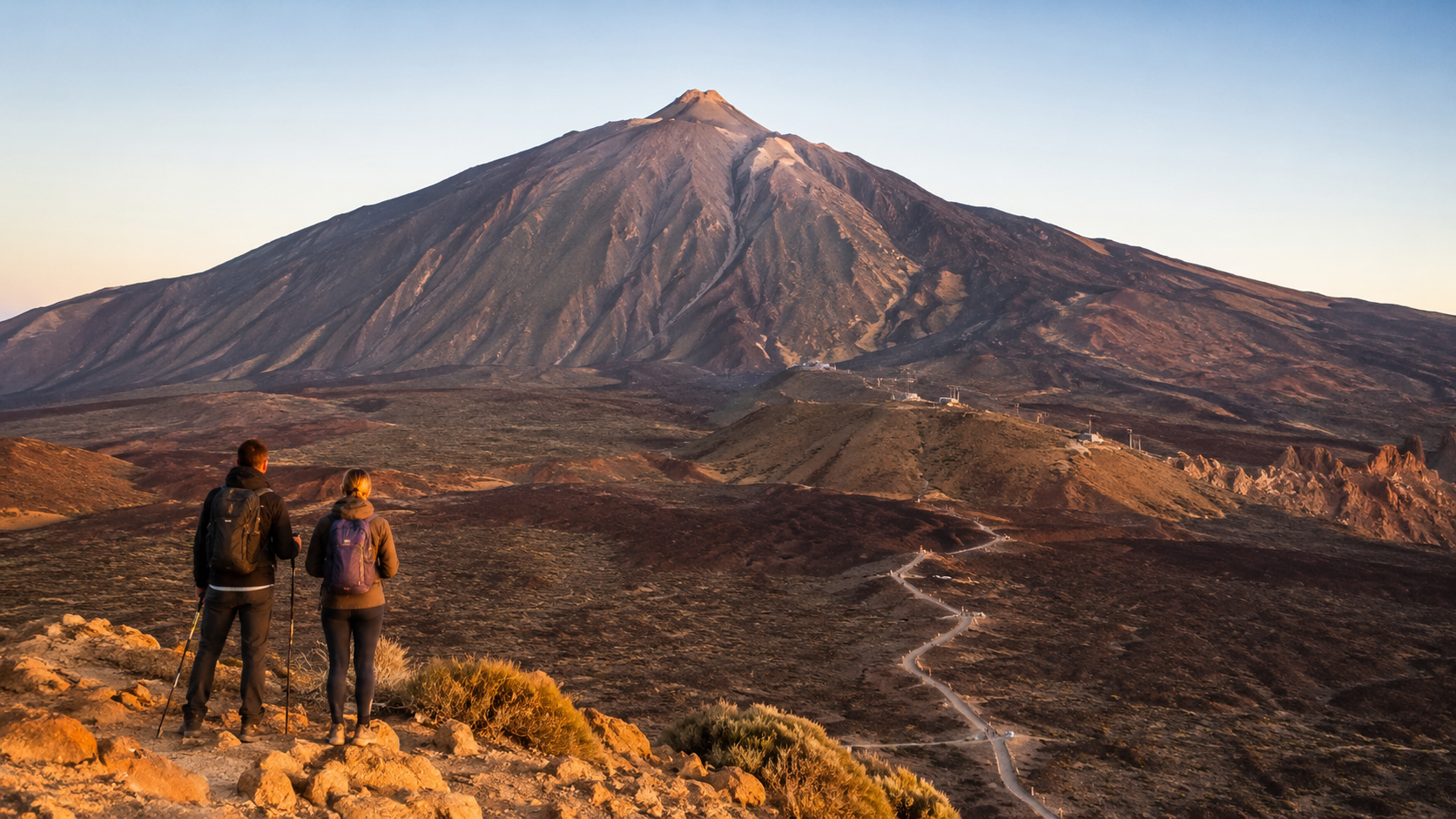 Hikers looking toward Mount Teide in Tenerife's volcanic national park landscape