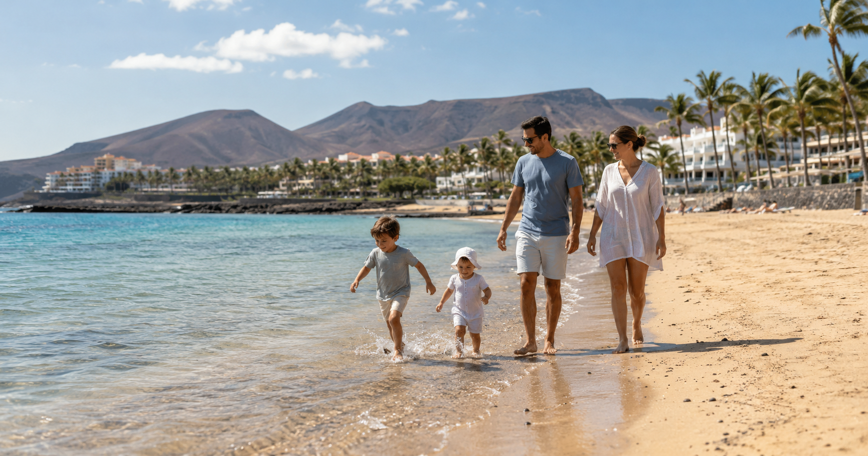 Family beach holiday scene in the Canary Islands for comparing Tenerife and Gran Canaria with young children