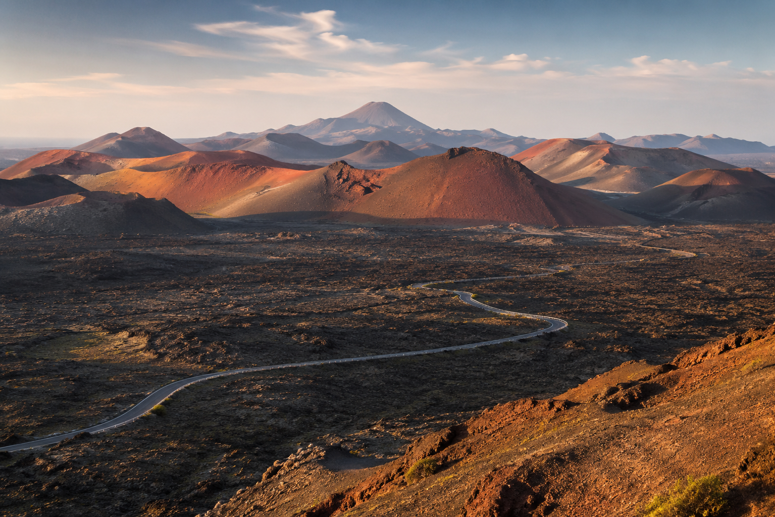Volcanic landscape of Timanfaya National Park in Lanzarote with red craters and black lava fields
