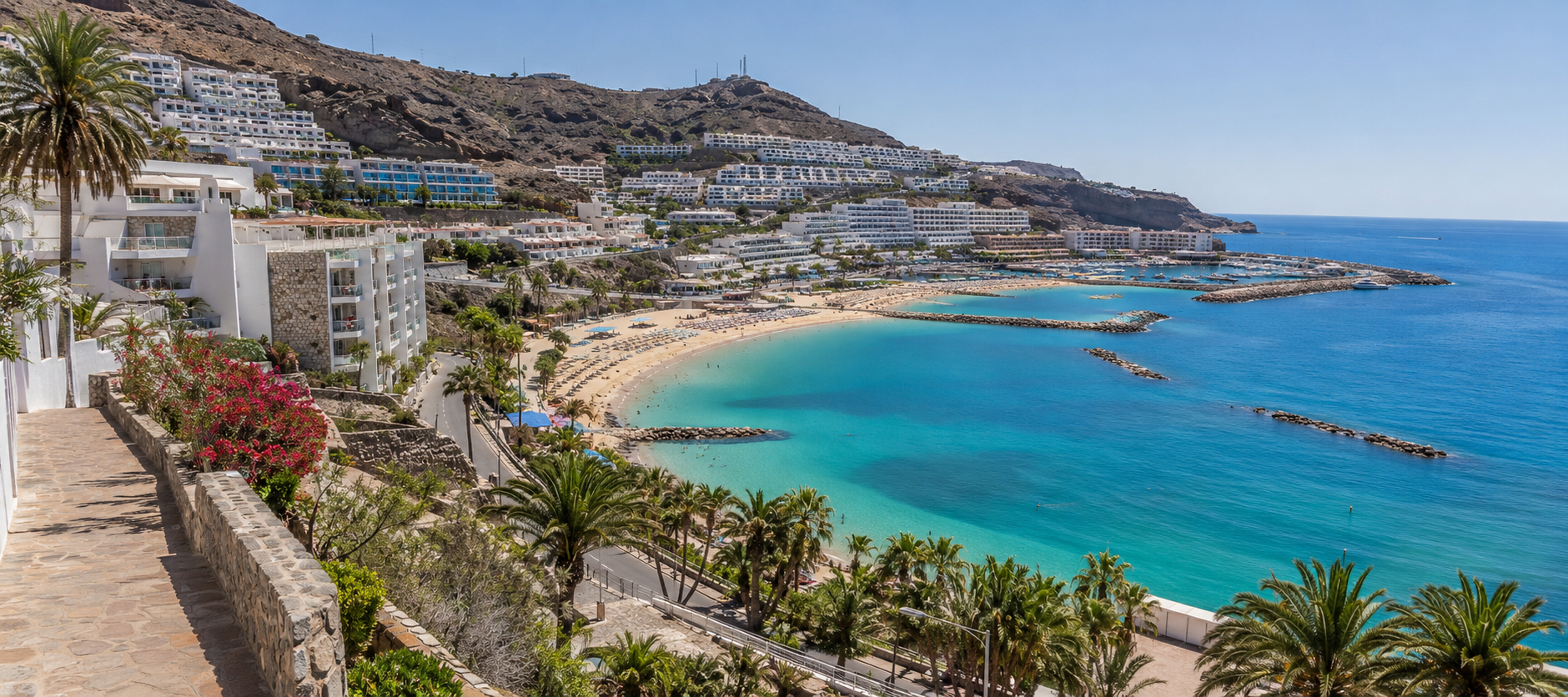 Puerto Rico and Amadores coastline in Gran Canaria with hillside hotels and beach areas