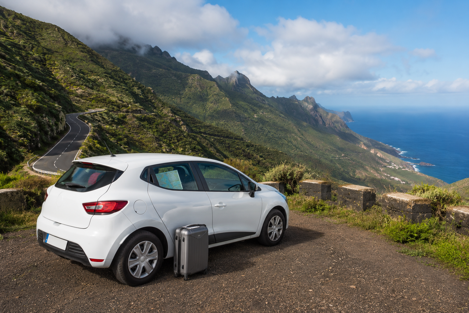 Compact rental car on a scenic north Tenerife mountain road for a Tenerife North Airport car hire guide
