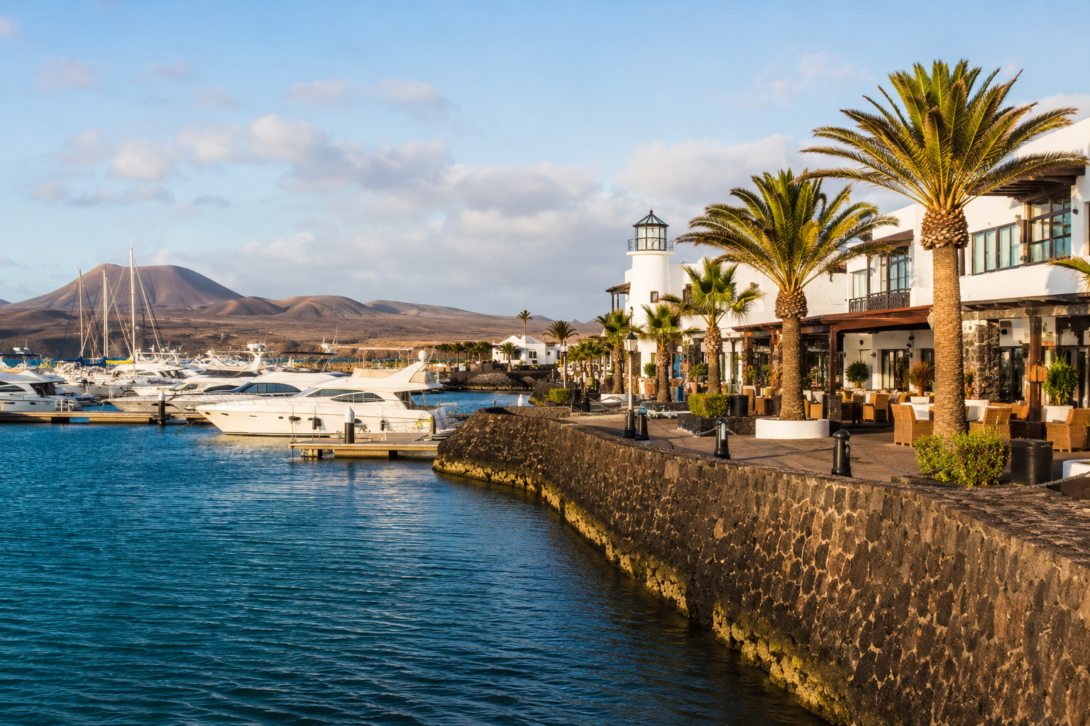 Marina Rubicon waterfront in Playa Blanca, Lanzarote with yachts and resort promenade
