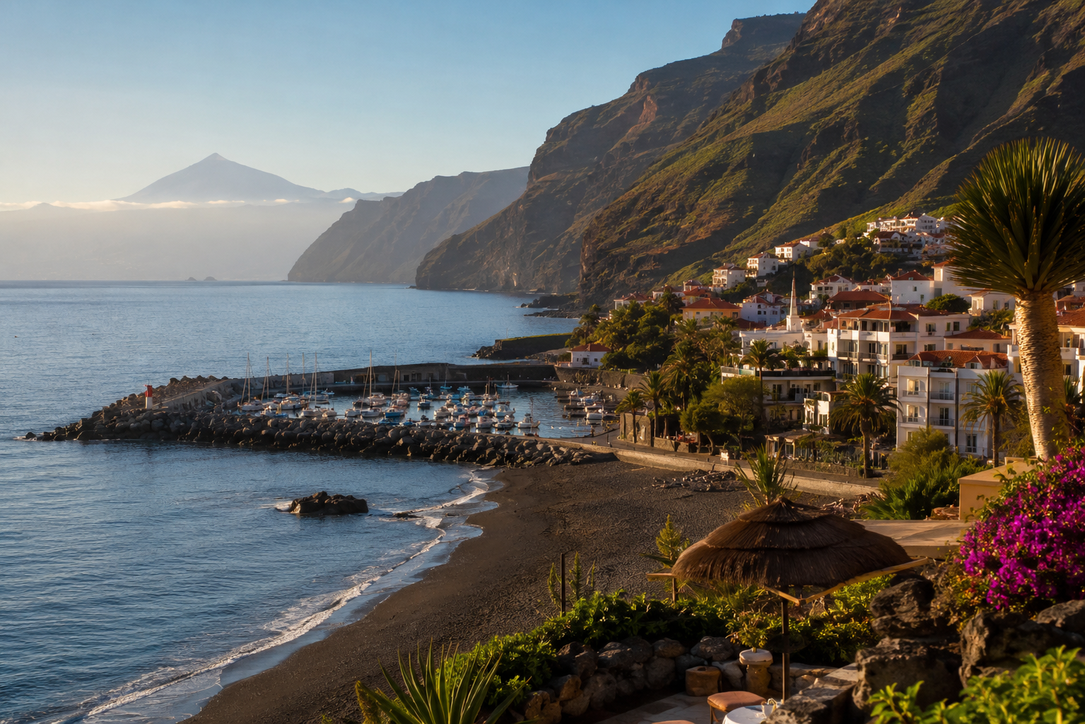 Playa de Santiago in La Gomera with volcanic beach, marina and south coast hotel scenery