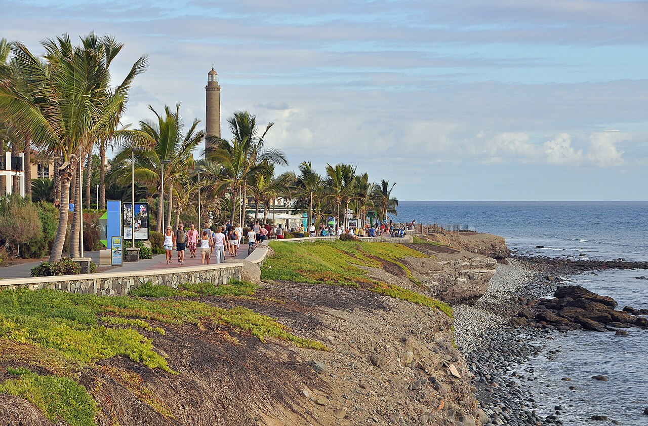 Palm-lined Meloneras promenade near Maspalomas lighthouse on Gran Canaria